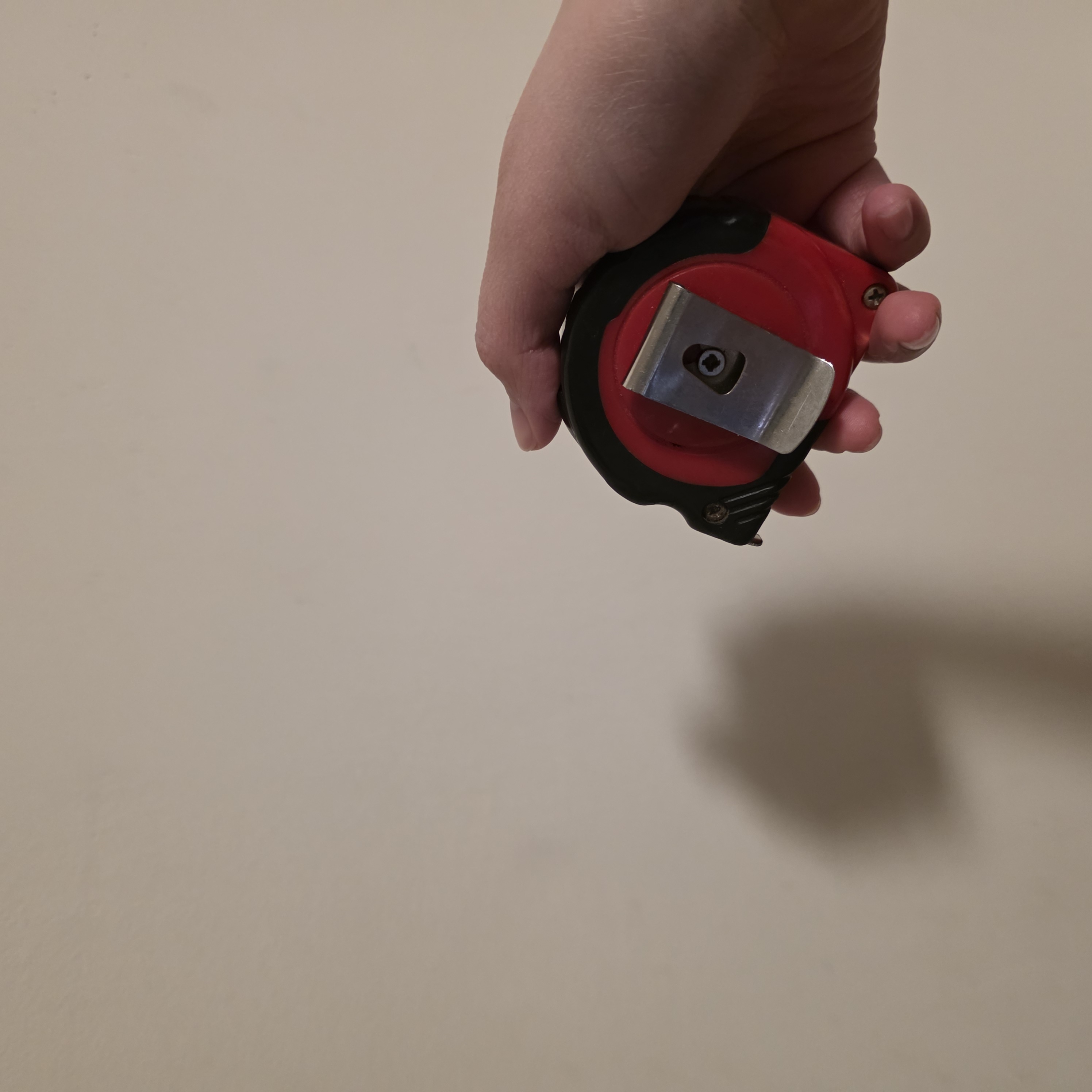 Measuring tape being close, showing that it serves as more of a physical interaction to close the measuring tape, will not be used.